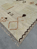 Hand-Knotted Ivory Wool Rug with Multicoloured Highlights | Woven Wonders